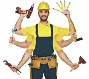 A man in yellow shirt holding tools and wearing blue work pants.